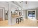 Bright open kitchen featuring stainless steel appliances and tile floors at 8218 Borgia Ct, Orlando, FL 32836