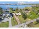 Stunning aerial view of lakefront homes with lush landscaping and private docks on a sunny day at 85 Interlaken Rd, Orlando, FL 32804