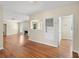 Bright living room with hardwood floors, a fireplace, and natural light streaming through windows at 85 Interlaken Rd, Orlando, FL 32804