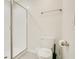 Clean bathroom featuring a glass shower stall and modern toilet at 8800 Interlocking Ct, Champions Gate, FL 33896