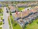 Aerial view of the beautiful townhome featuring a private screened in pool area and lush landscaping at 9017 Dogleg Dr, Davenport, FL 33896