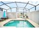 Refreshing pool area enclosed for privacy, complete with lounge chairs at 9017 Dogleg Dr, Davenport, FL 33896