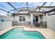 Private pool with safety fence and covered patio, perfect for outdoor enjoyment at 9017 Dogleg Dr, Davenport, FL 33896