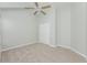 Neutral bedroom featuring carpeted floors, a ceiling fan, and a closet at 944 Glen Abbey Cir, Winter Springs, FL 32708