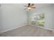 Well-lit bedroom featuring carpeted floors and a large window providing ample natural light at 944 Glen Abbey Cir, Winter Springs, FL 32708