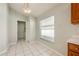 Bright breakfast nook with tiled floor, view to backyard, with convenient access to laundry at 944 Glen Abbey Cir, Winter Springs, FL 32708