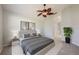 Serene main bedroom with a ceiling fan, plush bed, and stylish decor, creating a relaxing retreat at 944 Glen Abbey Cir, Winter Springs, FL 32708