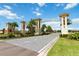 Community entrance with landscaped grounds and stately signage welcoming residents and visitors to Champions Gate at 1100 Downswing Pl, Davenport, FL 33896