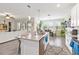 Bright and airy kitchen with a center island, modern appliances, and an adjacent dining area at 1100 Downswing Pl, Davenport, FL 33896
