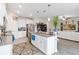 Open kitchen featuring a large island, stainless appliances, and view into the living area at 1100 Downswing Pl, Davenport, FL 33896