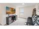 Upstairs sitting area featuring a black cabinet and a large flatscreen television at 1100 Downswing Pl, Davenport, FL 33896