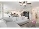 Open-concept living room flowing into the kitchen, featuring a comfortable sofa and modern décor at 1100 Downswing Pl, Davenport, FL 33896