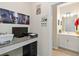 A home office space, featuring a desk and doorway view into the half bathroom at 1100 Downswing Pl, Davenport, FL 33896