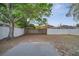 Spacious backyard with privacy fence, mature trees, and concrete pad at 1102 Brielle Ct, Oviedo, FL 32765