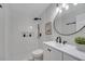 Sleek, updated bathroom featuring modern fixtures, stylish vanity, and walk-in shower with white tile surround at 1102 Brielle Ct, Oviedo, FL 32765