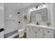 Modern bathroom featuring a walk-in shower, sleek vanity, updated fixtures, and stylish tile accents at 1102 Brielle Ct, Oviedo, FL 32765