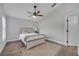 Serene bedroom with a vaulted ceiling, soft lighting, neutral decor, and a comfortable queen-sized bed at 1102 Brielle Ct, Oviedo, FL 32765