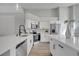 Bright, spacious kitchen with stainless steel appliances and white cabinetry at 1102 Brielle Ct, Oviedo, FL 32765