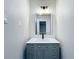 Bathroom features a modern gray vanity with a decorative mirror and light fixture at 1155 Orange Grove Ln, Apopka, FL 32712