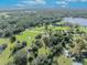 Expansive land featuring a large pond surrounded by lush greenery at 1350 N Hart Rd, Geneva, FL 32732