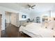 Bright main bedroom features a ceiling fan, tv, and hardwood floors at 13643 Budworth Cir, Orlando, FL 32832