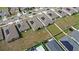 Aerial view of several homes with solar panels in the community at 1443 Lassen St, Haines City, FL 33844