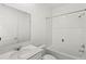 Clean bathroom features a shower-tub combo and vanity with countertop at 1443 Lassen St, Haines City, FL 33844