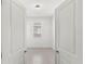 An open doorway reveals a bedroom with a window and a tile floor at 1443 Lassen St, Haines City, FL 33844