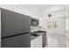 Close-up featuring a well-lit kitchenette with modern appliances and adjacent living area at 1443 Lassen St, Haines City, FL 33844
