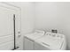 Practical laundry room featuring a washer and dryer at 1443 Lassen St, Haines City, FL 33844