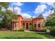 Charming two-story home with a beautiful lawn, arched entryway, and a clay tile roof at 2102 Sturbridge Ct, Winter Springs, FL 32708