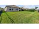 Large, well-maintained backyard, perfect for outdoor activities at 211 Venetian Palms Blvd, New Smyrna Beach, FL 32168