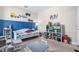 Nicely decorated bedroom with a play area and a blue accent wall at 211 Venetian Palms Blvd, New Smyrna Beach, FL 32168