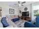 Cozy living room with comfortable seating, large windows, and a relaxing atmosphere at 211 Venetian Palms Blvd, New Smyrna Beach, FL 32168