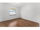 Bright bedroom showcasing wood-look floors and a window at 221 W Berkshire Cir, Longwood, FL 32779