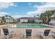 Community pool featuring lounge chairs, tables, and a clear blue pool at 224 Lewfield Cir, Winter Park, FL 32792