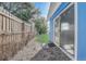 A charming backyard with a well-kept lawn, secure fencing, and mature trees offering shade at 2743 Grandola Dr, Orlando, FL 32811