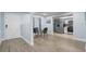 Inviting dining area with modern table and stainless steel appliances in the kitchen at 2743 Grandola Dr, Orlando, FL 32811