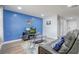 Cozy living room featuring a TV and comfortable seating, with a bright accent wall at 2743 Grandola Dr, Orlando, FL 32811
