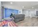 Bright living room with wood floors, recessed lighting, and a comfy leather sofa at 2743 Grandola Dr, Orlando, FL 32811