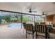 Covered patio with dining furniture and view of the pool at 30837 Westridge Ter, Sorrento, FL 32776