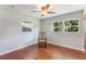 Bedroom showcases beautiful hardwood floors, natural light and a rocking chair at 3111 Carmia Dr, Orlando, FL 32806