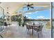 A sun-filled screened patio has tile floors and a lovely lake view at 3111 Carmia Dr, Orlando, FL 32806