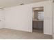 Neutral bedroom showcasing a glimpse of the ensuite bathroom at 313 Marquee Dr, Kissimmee, FL 34758
