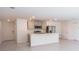 Modern kitchen with an island, stainless steel appliances, and an open concept layout at 313 Marquee Dr, Kissimmee, FL 34758