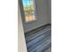 Bedroom featuring a window with natural light and attractive gray-toned flooring at 3324 Sw 137Th Loop, Ocala, FL 34473