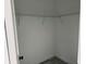 Compact walk-in closet with installed shelving, providing efficient storage solutions and organization at 3324 Sw 137Th Loop, Ocala, FL 34473