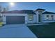 Charming single-story home with a two-car garage and a well-manicured front yard at 3324 Sw 137Th Loop, Ocala, FL 34473