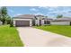 This inviting home offers a two-car garage and well manicured landscaping at 3324 Sw 137Th Loop, Ocala, FL 34473