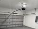 Spacious two-car garage with an automatic door, providing secure parking and extra storage at 3324 Sw 137Th Loop, Ocala, FL 34473